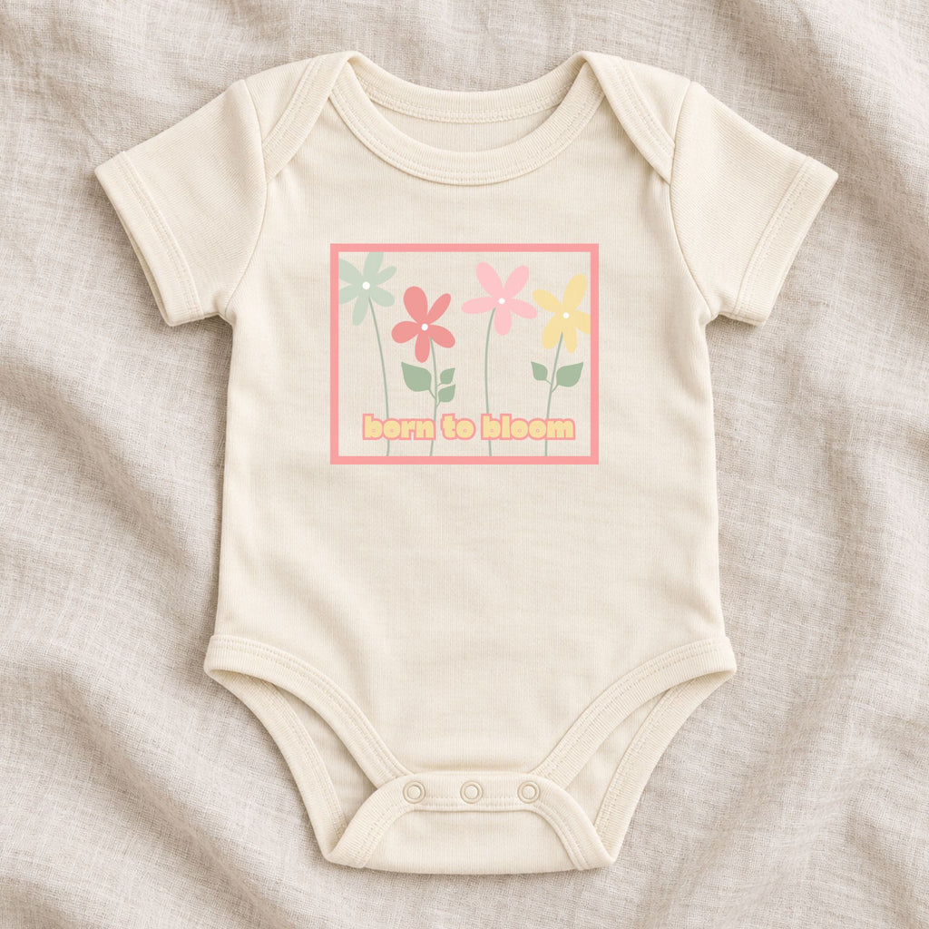 Natural Born to Bloom infant bodysuit flat lay with a colorful retro flower design.