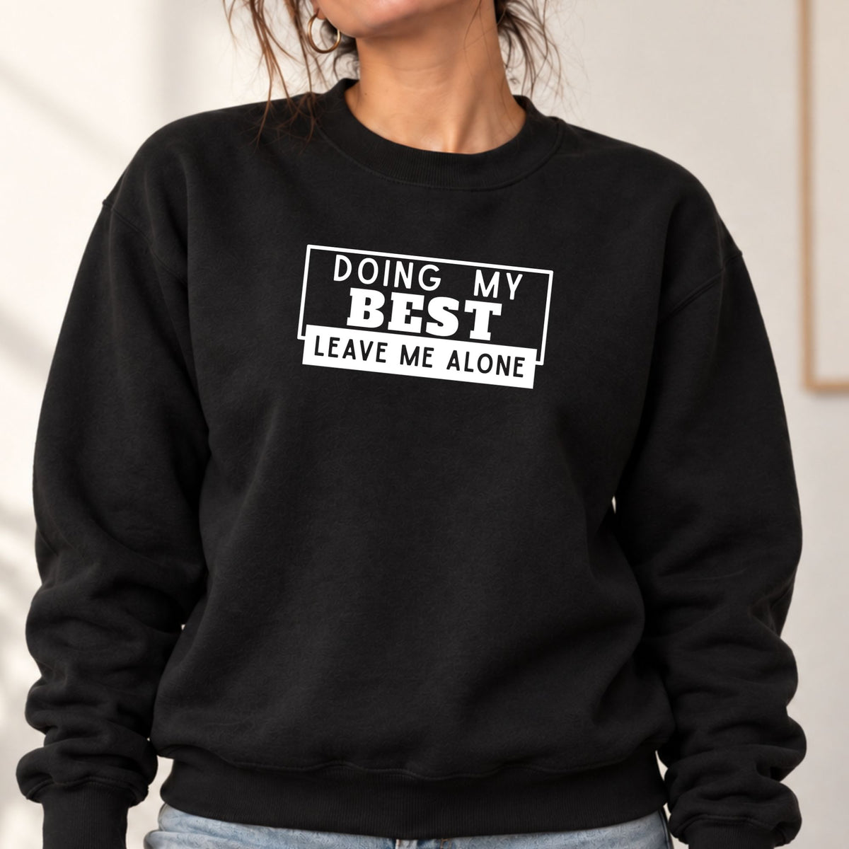 Woman wearing a black Doing My Best Leave Me Alone adult crewneck sweatshirt
