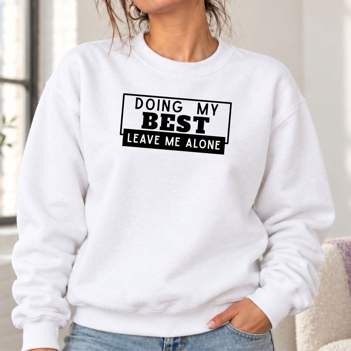 Woman wearing a white Doing My Best Leave Me Alone adult crewneck sweatshirt