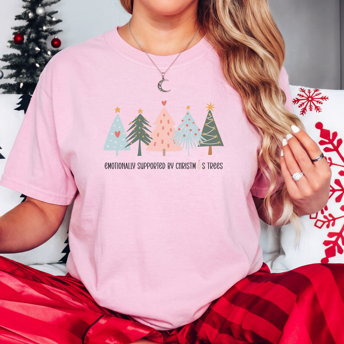 Emotionally Supported by Christmas Trees graphic tee in soft pink, styled for Christmas
