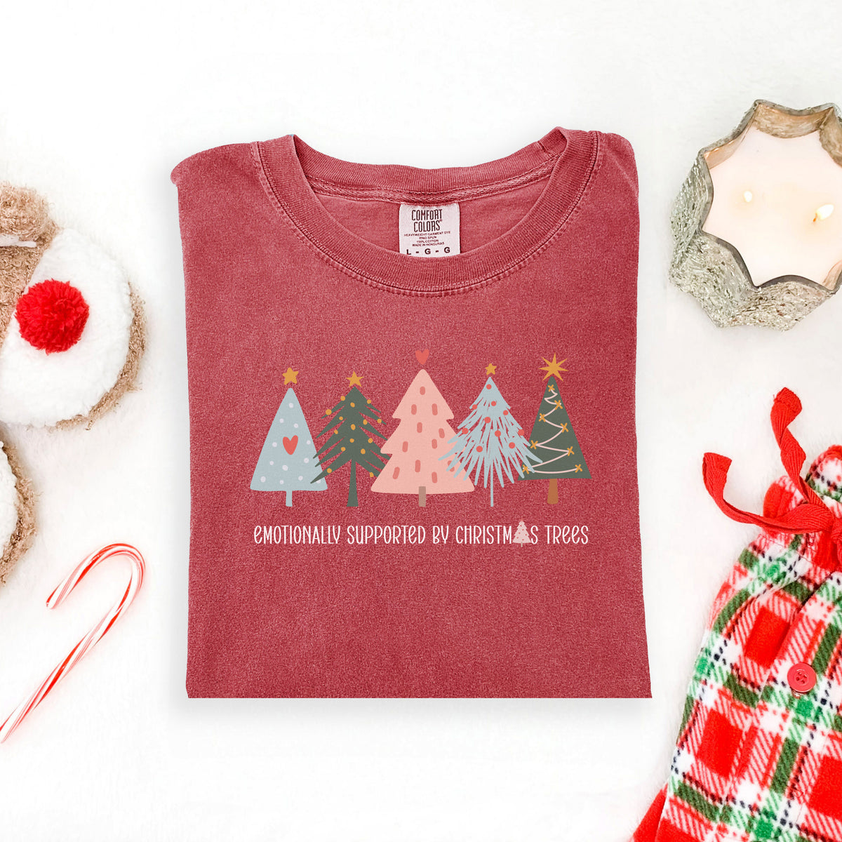 Emotionally Supported by Christmas Trees adult graphic tee in vintage red, front flat lay