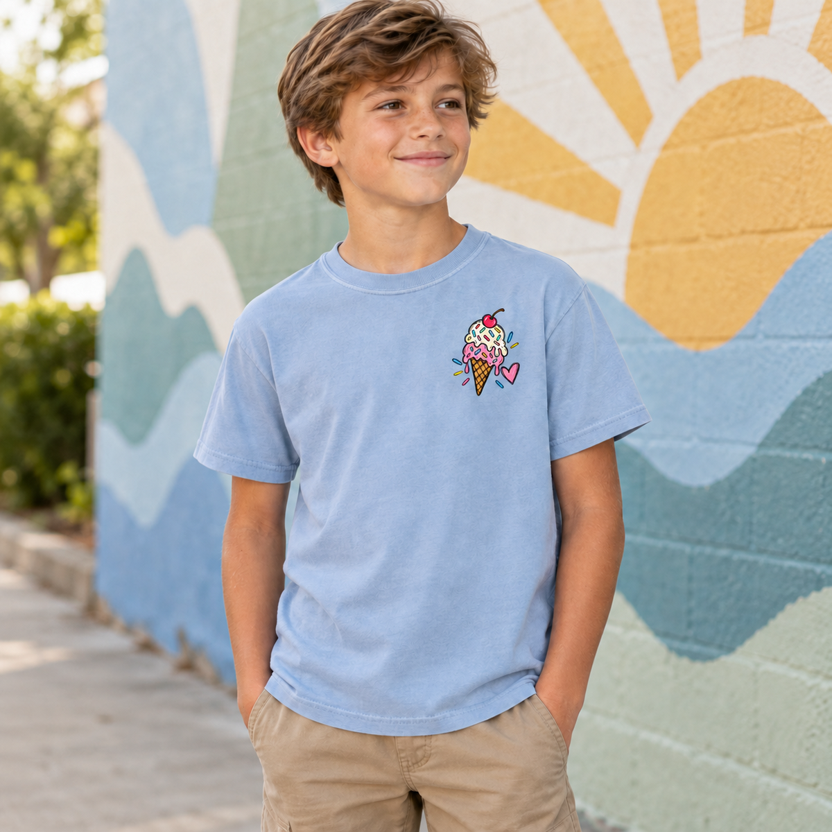 Youth wearing a chambray Ice Cream Club tee, front view showing the ice cream left-chest design.