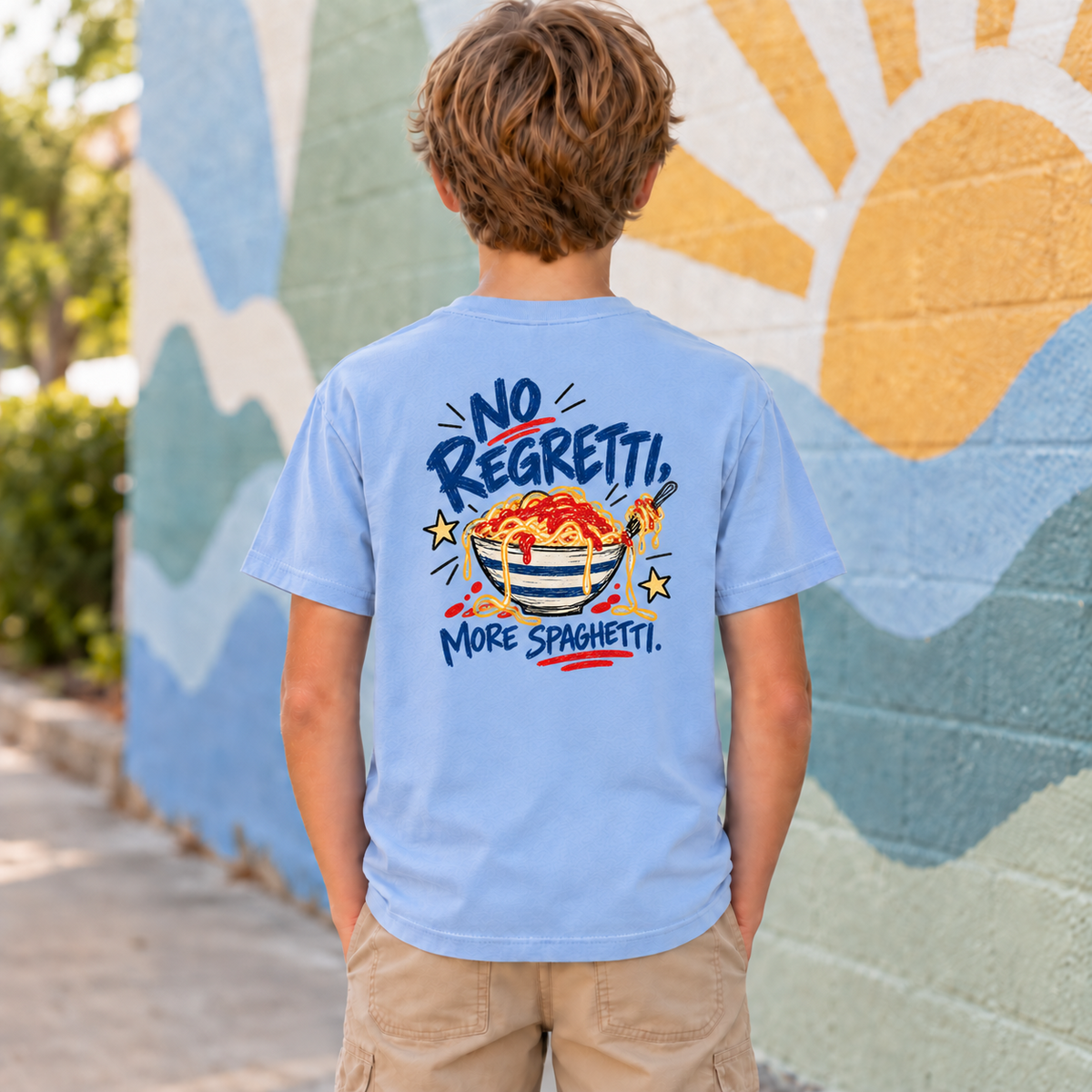 Youth model wearing a light blue No Regretti More Spaghetti short sleeve tee, back view showing the full No Regretti More Spaghetti bowl graphic.