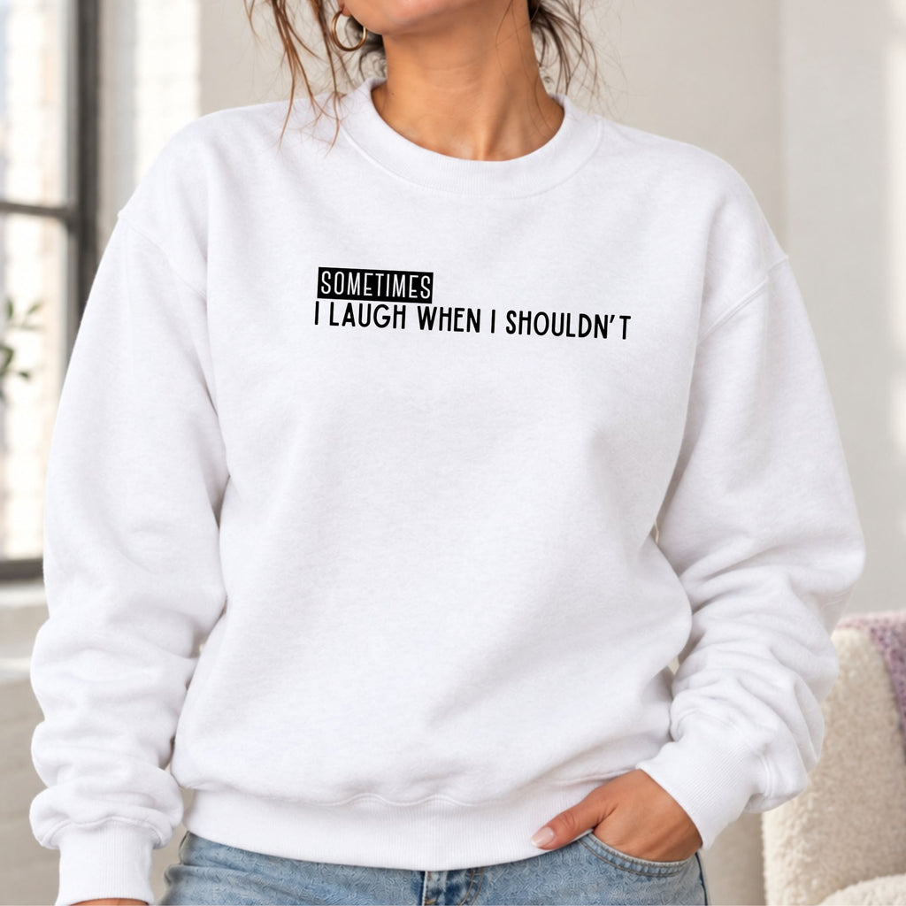 Woman wearing a white Sometimes I Laugh When I Shouldn’t adult crewneck sweatshirt